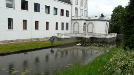 Sonja litters with art in the chateau moat.