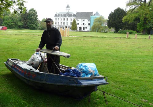 Old Man in boat irons past Chateau Bethlehem